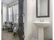 Cozy powder room showcasing a pedestal sink and stylish design elements at 200 Wallace St, Fayetteville, GA 30214