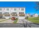 New townhomes with driveways and balconies, set on a lush green lawn at 200 Wallace St, Fayetteville, GA 30214