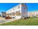 Well-manicured lawn outside the townhomes, each with a balcony at 200 Wallace St, Fayetteville, GA 30214