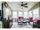 Relaxing sunroom with wicker furniture and large windows at 2543 Laurel View Ct, Snellville, GA 30078