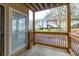 Covered patio with wooden railings and view of backyard at 305 Berkeley Woods Dr, Duluth, GA 30096