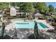 Community pool with plenty of lounge chairs at 305 Berkeley Woods Dr, Duluth, GA 30096