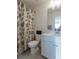 Clean bathroom with a shower/tub combo and white vanity at 925 Eldridge Rd, Hampton, GA 30228