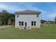 Two story home with patio and grassy backyard at 247 Tulip Dr, Covington, GA 30016