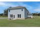 Two story home with patio and grassy backyard at 247 Tulip Dr, Covington, GA 30016