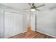 Hardwood floor bedroom with double doors leading to bathroom at 270 Gordon Woods Sw Dr, Mableton, GA 30126