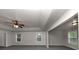 Large bedroom with ceiling fan and multiple windows at 6920 Talkeetna Ct, South Fulton, GA 30331