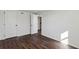 Simple bedroom with dark brown vinyl flooring and white walls at 1721 Hortense Nw Pl, Atlanta, GA 30318