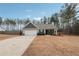 Gray sided house with attached garage and small front porch at 218 Cynthia Ct, Dallas, GA 30157