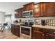 Kitchen with stainless steel appliances and granite countertops at 218 Cynthia Ct, Dallas, GA 30157