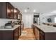 Modern kitchen with dark wood cabinets, stainless steel appliances, and granite counters at 218 Cynthia Ct, Dallas, GA 30157