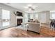 Living room with hardwood floors, fireplace, and access to backyard at 218 Cynthia Ct, Dallas, GA 30157