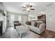 Open concept living room with a fireplace, neutral decor, and hardwood floors at 218 Cynthia Ct, Dallas, GA 30157