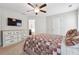 Main bedroom with ceiling fan and ensuite bathroom access at 218 Cynthia Ct, Dallas, GA 30157
