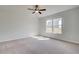 Spacious bedroom with ceiling fan and large windows at 258 Tulip Dr, Covington, GA 30016