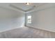 Bright bedroom with carpeted floor and large window at 258 Tulip Dr, Covington, GA 30016