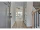 Bright entryway with gray walls, wood-look floors, and view of the kitchen at 258 Tulip Dr, Covington, GA 30016