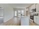 Modern kitchen with white cabinets, quartz countertops, and stainless steel appliances at 258 Tulip Dr, Covington, GA 30016