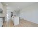 Open kitchen with island and views to living areas at 258 Tulip Dr, Covington, GA 30016