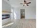 Living room with hardwood floors, fireplace and view of entryway at 258 Tulip Dr, Covington, GA 30016