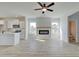 Open concept living room with hardwood floors, fireplace and kitchen at 258 Tulip Dr, Covington, GA 30016