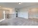 Bright upper hallway with a view to the living room and laundry area at 258 Tulip Dr, Covington, GA 30016