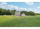 Aerial view of two story house with large backyard at 615 Henderson Mill Rd, Covington, GA 30014