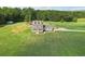 Aerial view of two story house with large backyard and detached garage at 615 Henderson Mill Rd, Covington, GA 30014