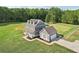 Aerial view of two story house with large backyard and detached garage at 615 Henderson Mill Rd, Covington, GA 30014