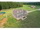 Aerial view of two story house with large backyard and detached garage at 615 Henderson Mill Rd, Covington, GA 30014