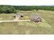 House and detached garage on a large lot with open fields at 615 Henderson Mill Rd, Covington, GA 30014