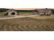 Aerial shot of house and barn at sunset at 615 Henderson Mill Rd, Covington, GA 30014