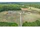 House and detached garage on a large lot with open fields at 615 Henderson Mill Rd, Covington, GA 30014