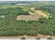 Aerial view of expansive property with two homes and a large lot at 615 Henderson Mill Rd, Covington, GA 30014