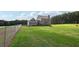 Spacious backyard with large grassy area and home at 615 Henderson Mill Rd, Covington, GA 30014