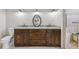 Double vanity bathroom with granite countertops at 615 Henderson Mill Rd, Covington, GA 30014