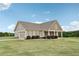 House exterior showcasing a spacious lawn at 615 Henderson Mill Rd, Covington, GA 30014