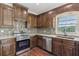 Kitchen with stainless steel appliances and a stylish backsplash at 615 Henderson Mill Rd, Covington, GA 30014