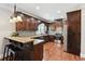 Spacious kitchen with granite countertops, stainless steel appliances, and dark wood cabinets at 615 Henderson Mill Rd, Covington, GA 30014