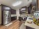 Modern kitchen with stainless steel appliances and dark cabinetry at 2974 Gayle Manor Ln, Snellville, GA 30078