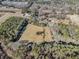 Aerial view of land surrounded by trees and neighborhood at 1875 Abbie Ln, Jonesboro, GA 30236