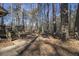 Wooded backyard with steps leading down from deck at 1875 Abbie Ln, Jonesboro, GA 30236