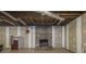 Unfinished basement with stone fireplace and tiled floor at 1875 Abbie Ln, Jonesboro, GA 30236