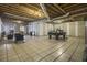 Unfinished basement with tiled floor, exposed beams, and a pool table at 1875 Abbie Ln, Jonesboro, GA 30236