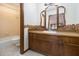 Bathroom with wood vanity and tri-fold mirror at 1875 Abbie Ln, Jonesboro, GA 30236