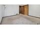 Empty bedroom with carpeted floors and door to hallway at 1875 Abbie Ln, Jonesboro, GA 30236