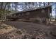 Back of Ranch home with green metal roof and wood siding at 1875 Abbie Ln, Jonesboro, GA 30236
