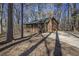 Ranch home with green metal roof, wood siding, and large yard at 1875 Abbie Ln, Jonesboro, GA 30236