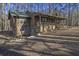 Ranch home with green metal roof and wood siding at 1875 Abbie Ln, Jonesboro, GA 30236