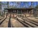 Rustic wooded home with large covered porch at 1875 Abbie Ln, Jonesboro, GA 30236